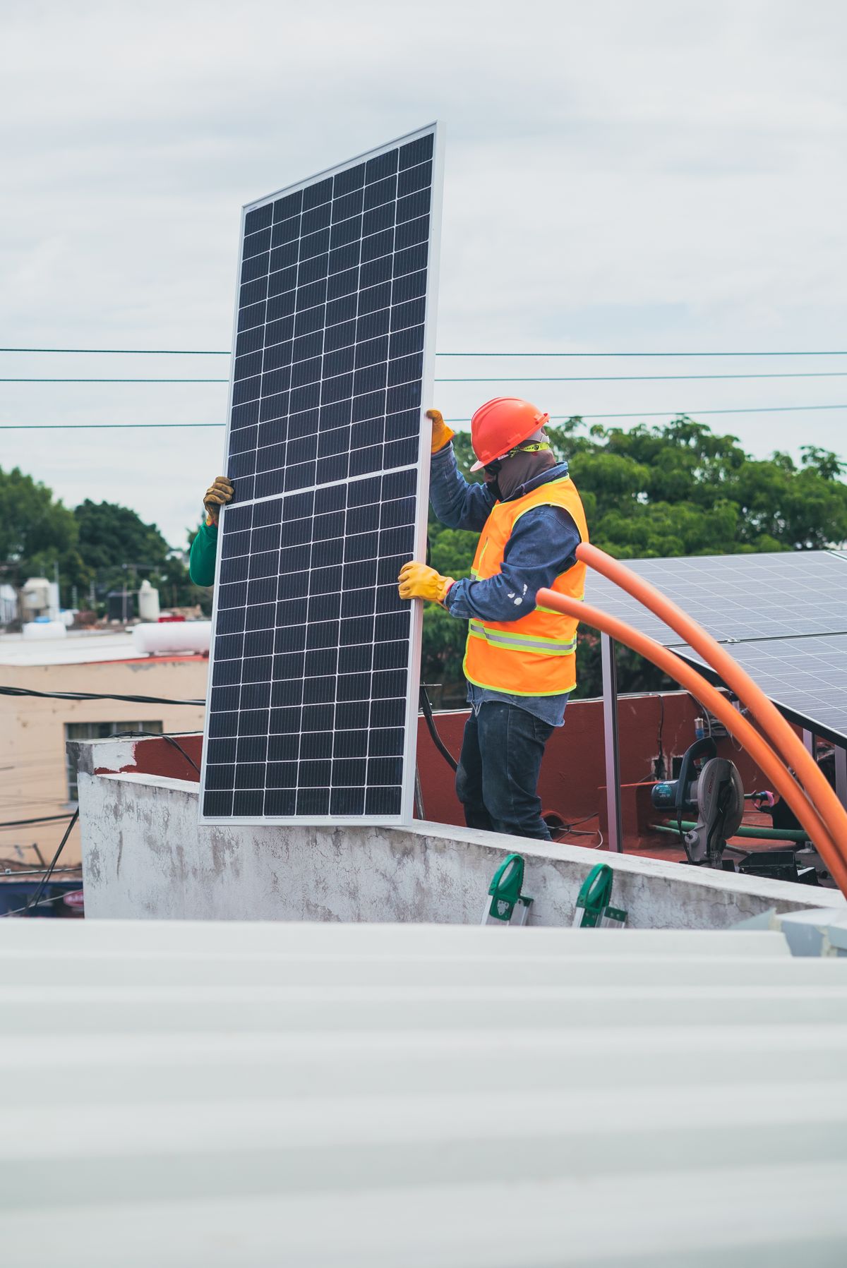 Solar panel rooftop installation by technicians