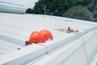 Red Helmet on White Wooden Fence