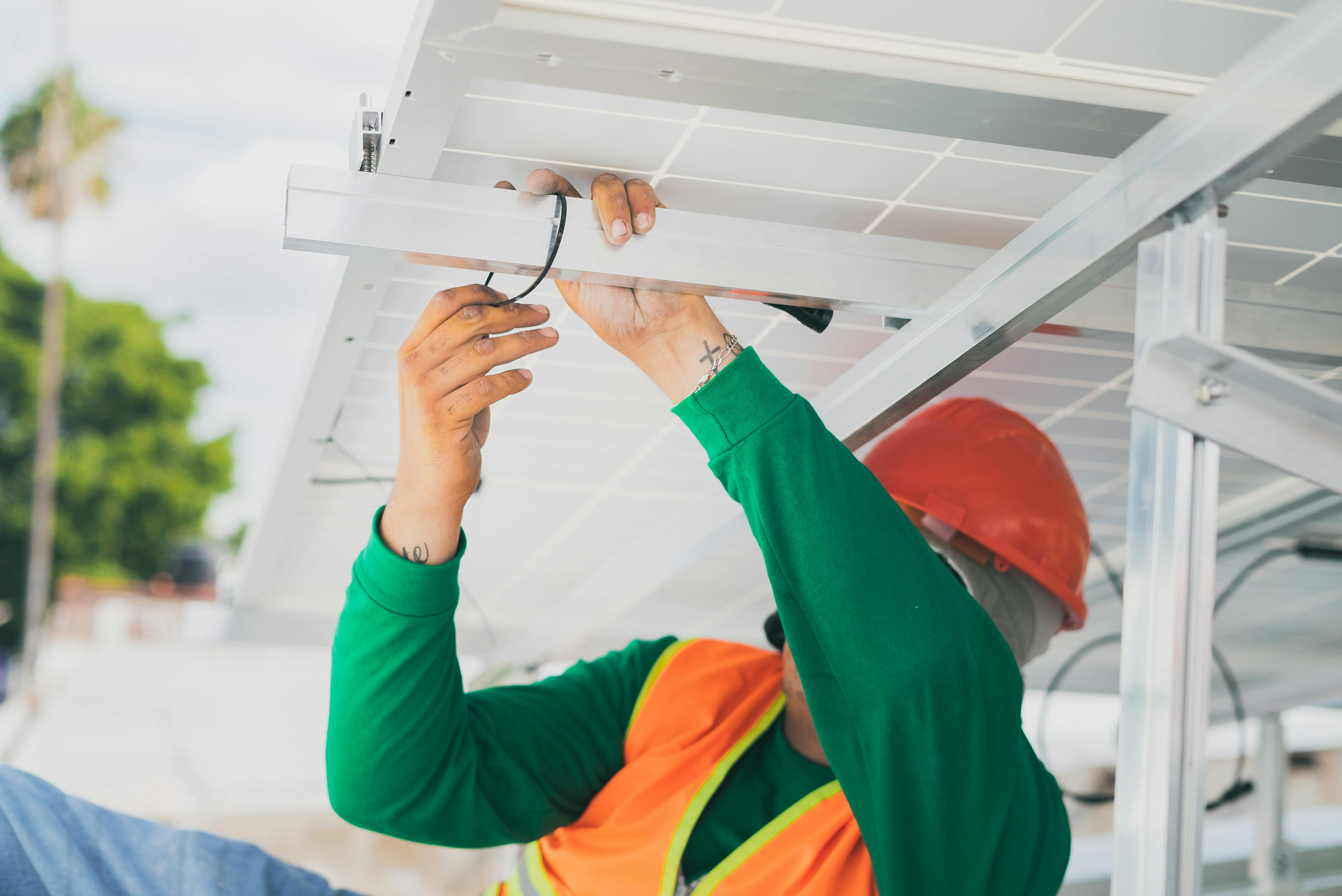 construction worker holding on a purlin