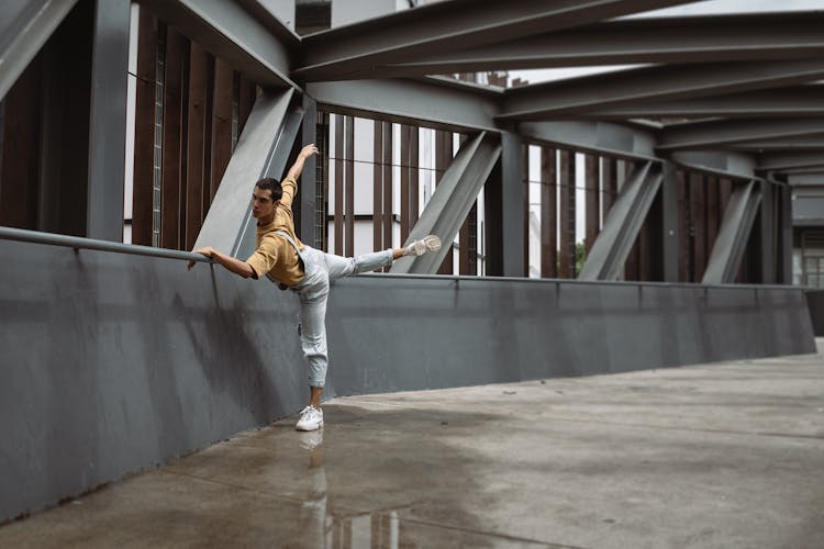 A Man Dancing In A Driveway