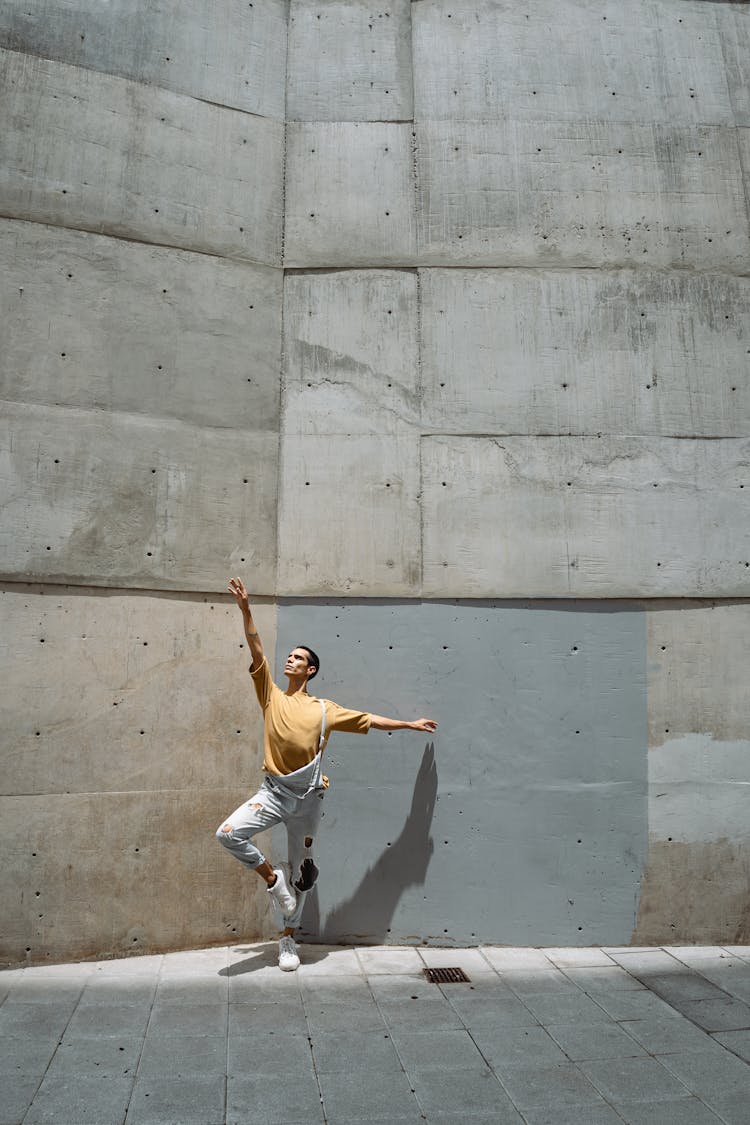 Dancer Dancing Ballet Beside A Concrete Wall