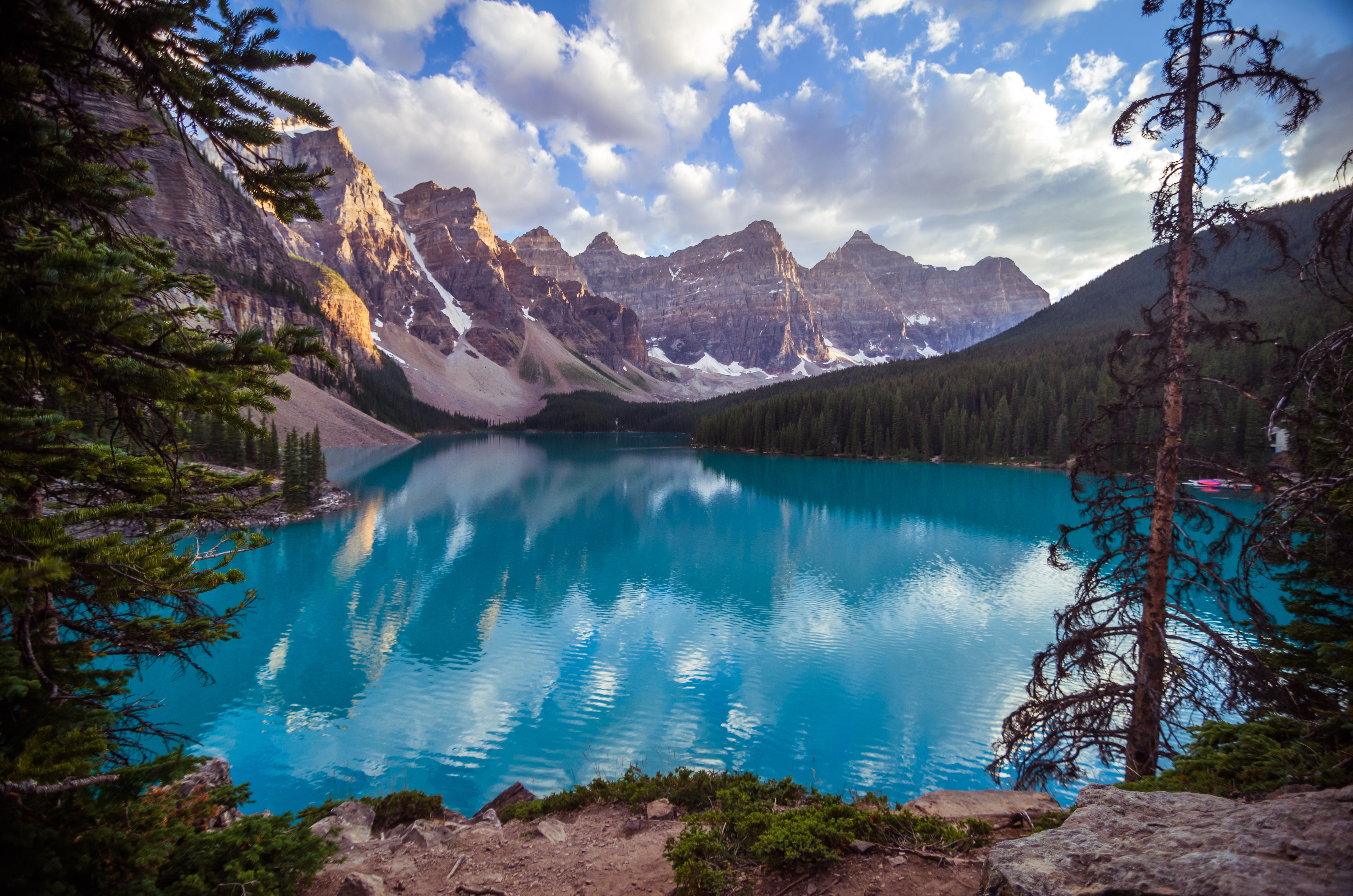 Free Tranquil Moraine Lake surrounded by the breathtaking Rocky Mountains in Banff National Park. Stock Photo