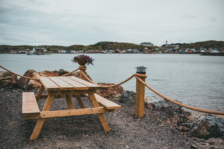 Outdoor Wooden Table And Bench Near A River