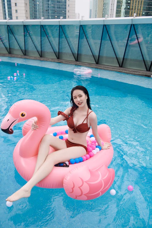 Free Woman Wearing Bikini on a Floater Stock Photo