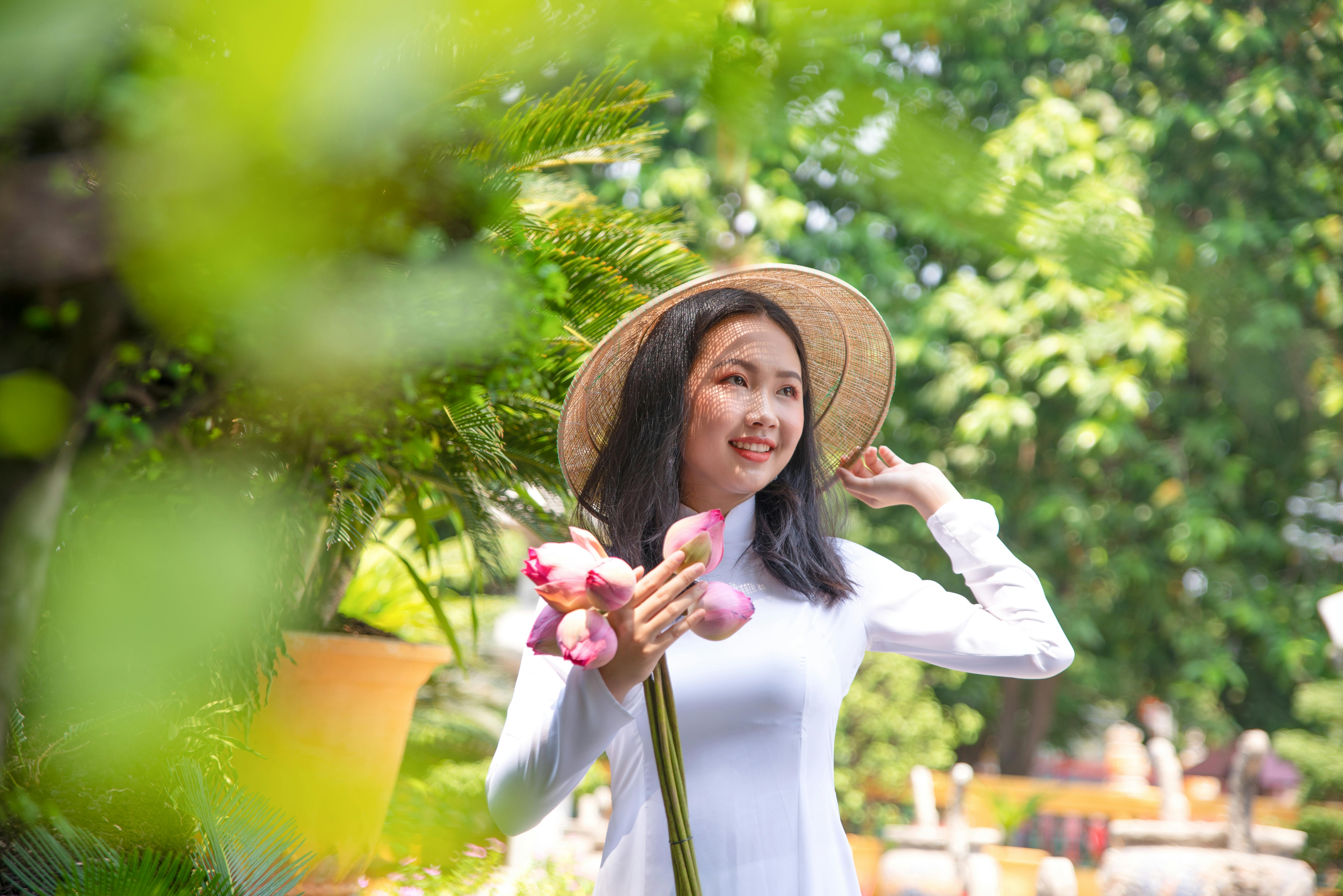 elegant woman wearing conical hat