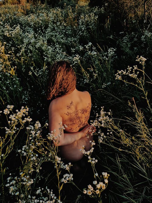 Topless Woman on Flower Field 