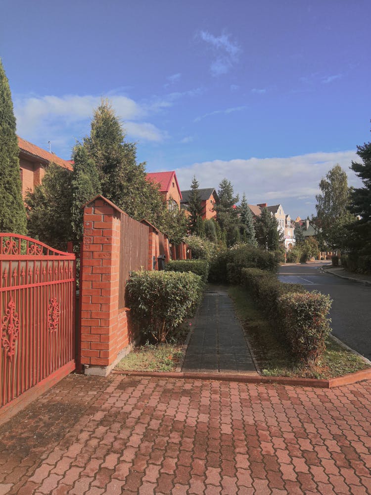 A Sidewalk In A Neighborhood