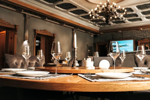 A luxurious dining room setup featuring candles and elegant glassware, perfect for fine dining experiences.