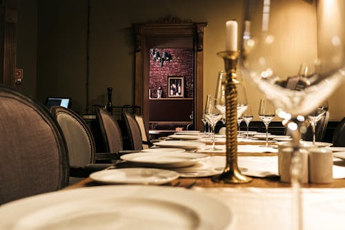 Free Plates and Wine Glasses on a Table Stock Photo