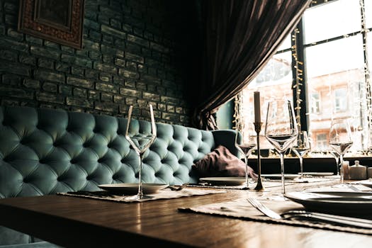 Sophisticated dining table with wine glasses and cutlery in a stylish restaurant.