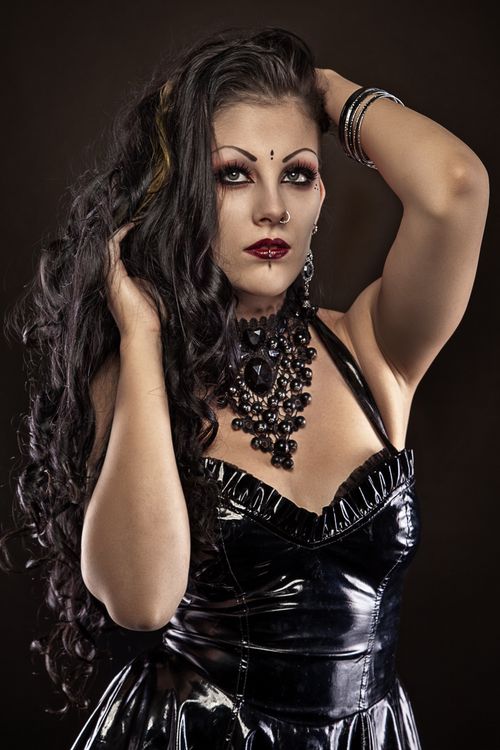 Free A stylish portrait of a woman in gothic fashion posing confidently. Stock Photo