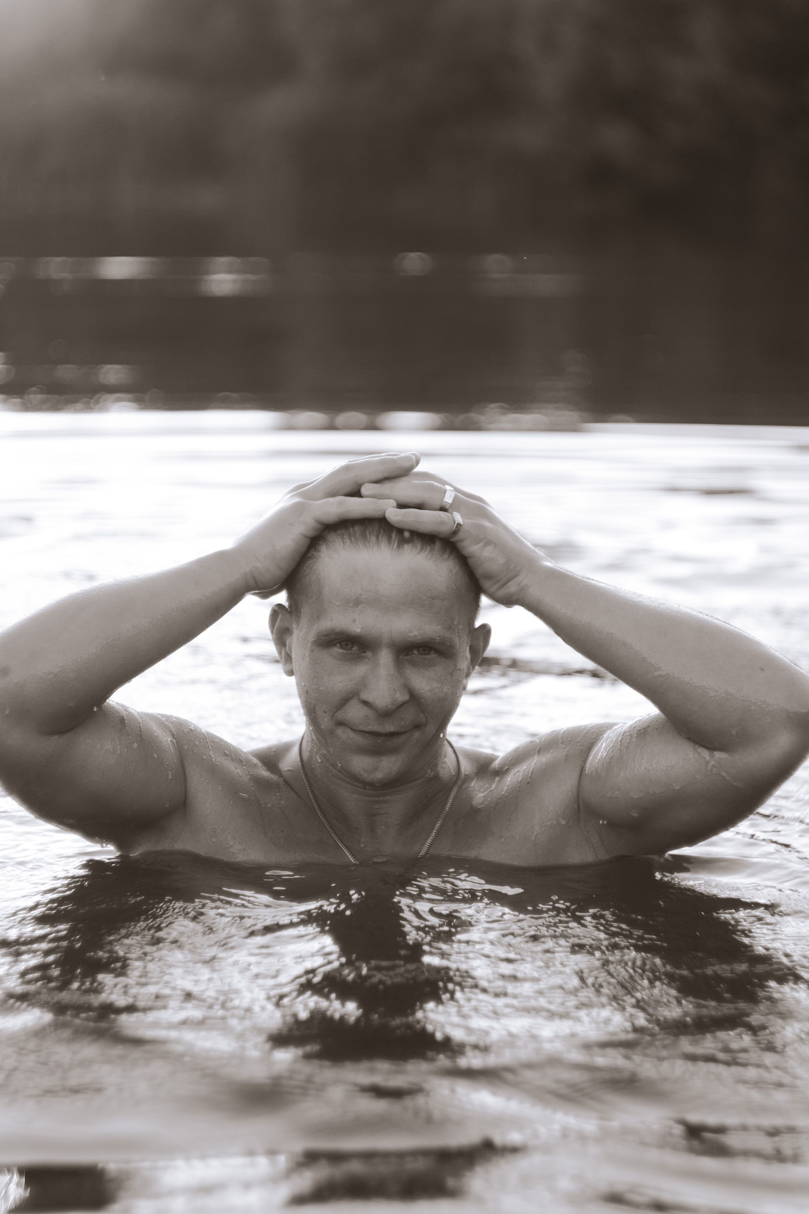 Black and White Photo of a Man in Water · Free Stock Photo