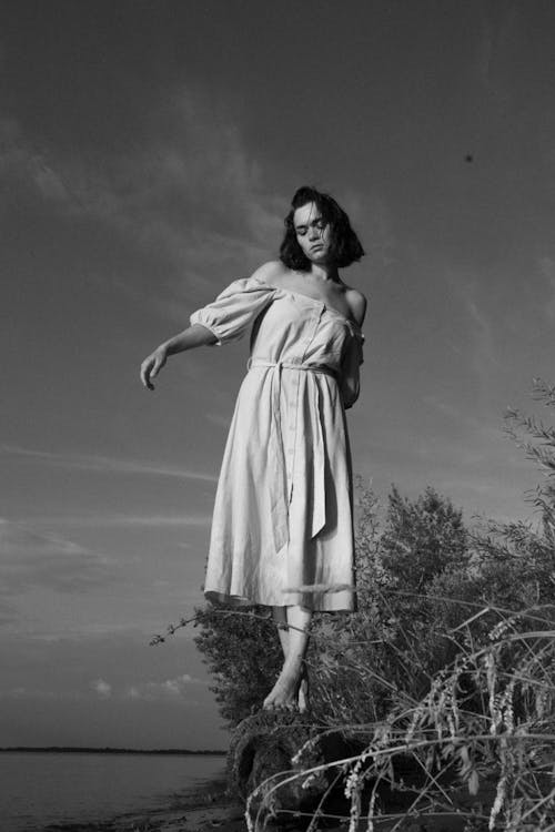 Grayscale Photo of Woman Wearing Dress