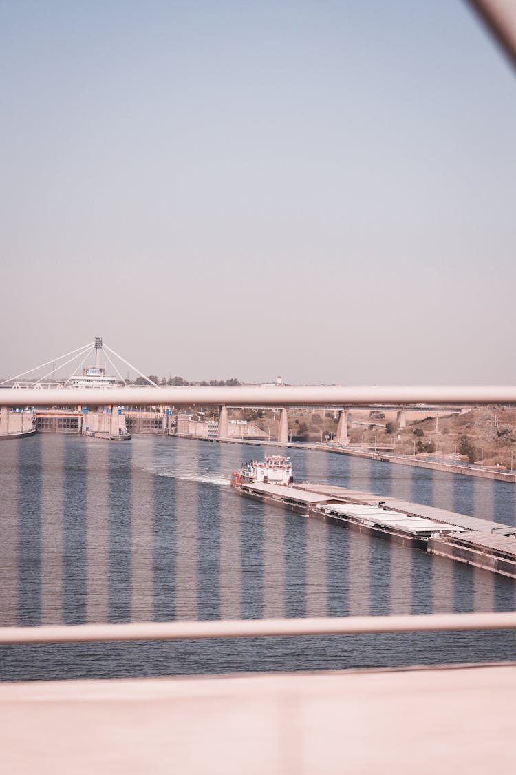 Push Boat And Barges On A River Photographed From A Bridge 