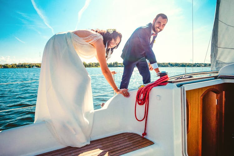 A Happy Newlywed Couple On A Boat