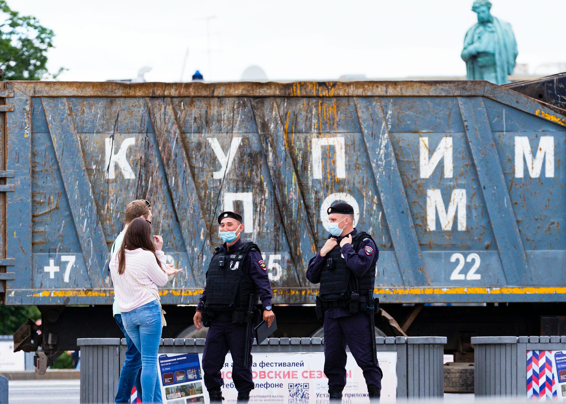 A Couple Talking to Russian Policemen