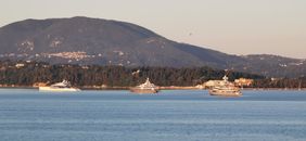 White Boat on Sea Near Mountain
