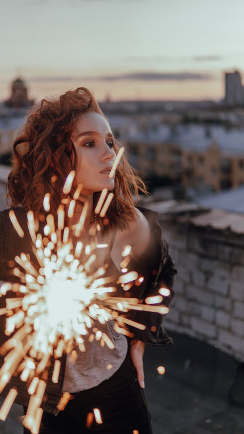 A Woman with Sparkling Fireworks