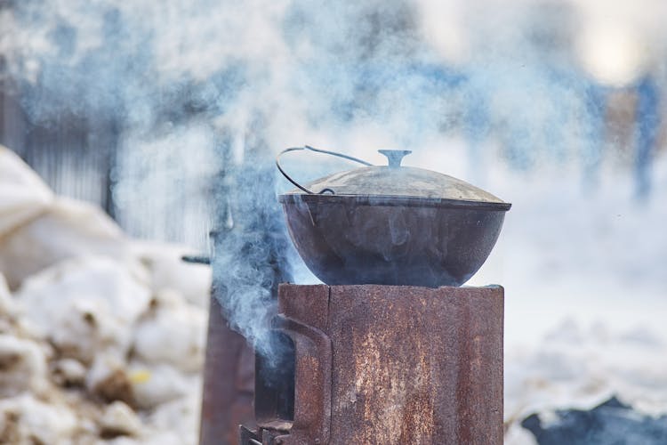 A Cast Iron Pot On A Metal Stove