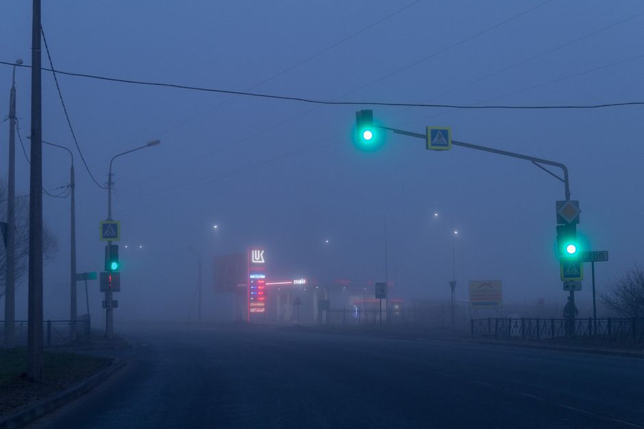 traffic light beams in dense fog with glowing colors - long exposure urban fog traffic light beams in dense fog with glowing colors - long exposure urban fog