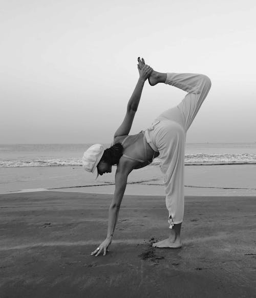 Woman Doing Yoga on Beachside