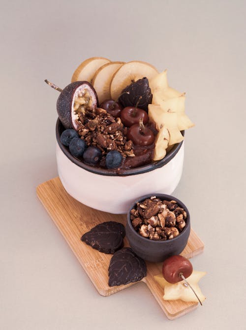 Sliced Fruits and Nuts on the Cutting Board