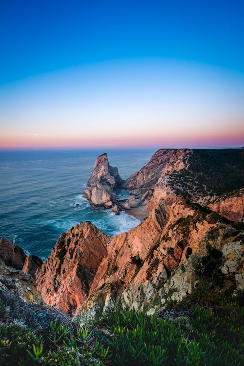 Pink Sunset above Cliffs and Ocean