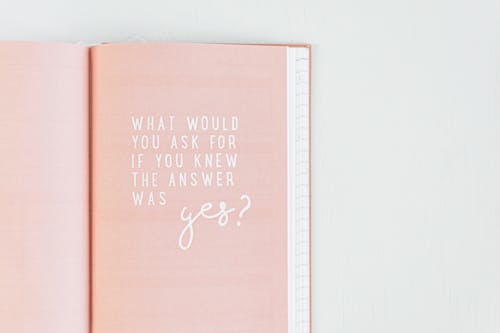 Pink Page in a Notebook with a Motivational Quote 