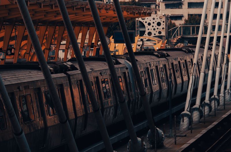 A dynamic view of a passenger train at an urban railway station