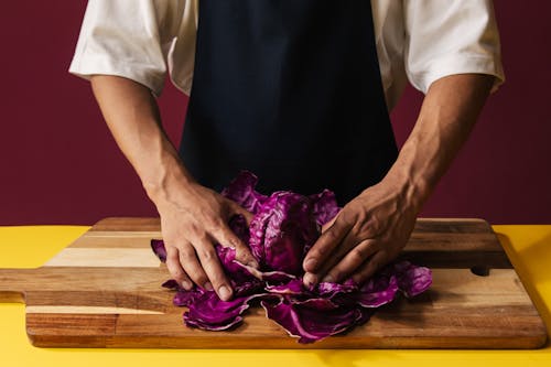 Free A Person Holding a Red Cabbage Stock Photo