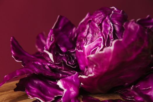 Close-up of vibrant red cabbage with rich colors and textures, highlighting its organic nature.