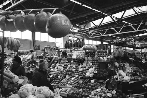 People Looking on a Fruit Stand