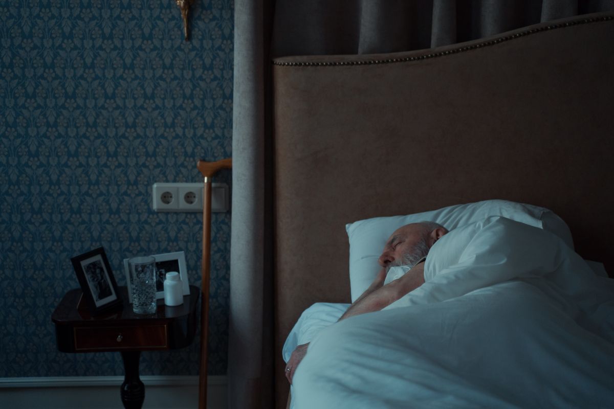 Older adult sleeping comfortably in a bedroom
