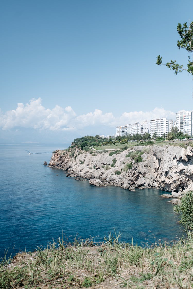 Cliff Coast Near Ocean Under The Sky