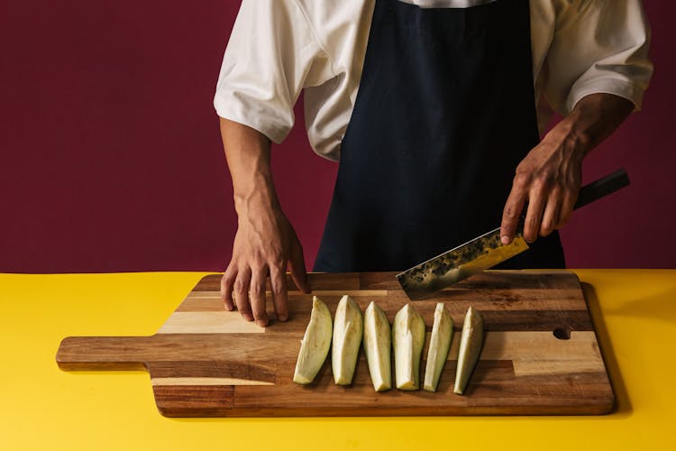 Person Slicing Vegetables