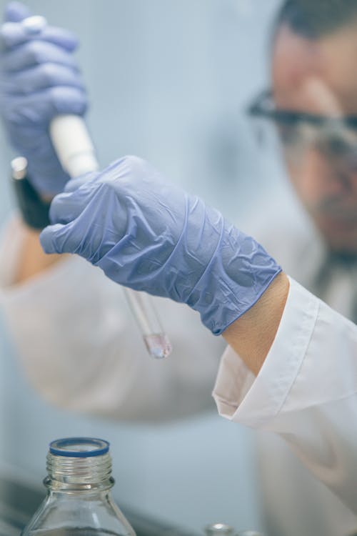 A Scientist Using Test Tube in an Experiment