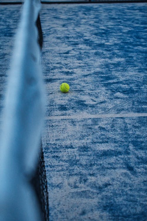 Free Yellow Tennis Ball in the Court Stock Photo
