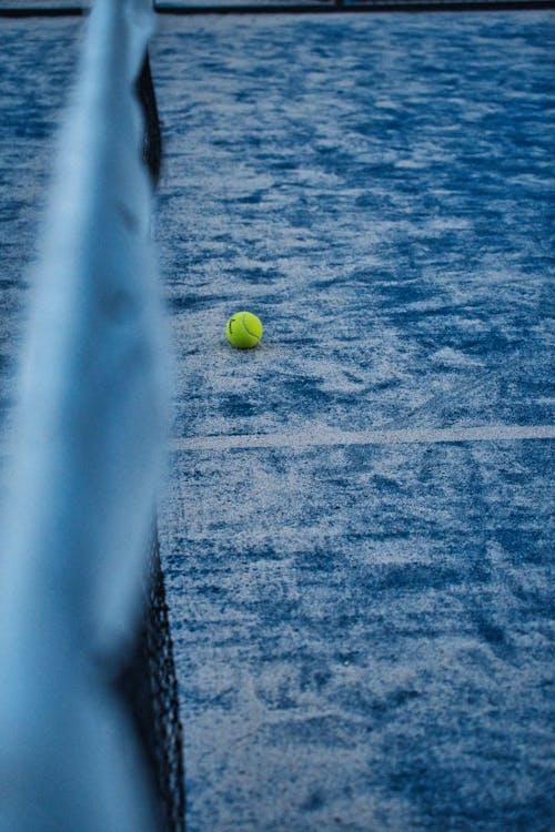 Yellow Tennis Ball in the Court