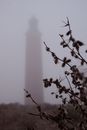 Thick Fog Covering a Lighthouse Tower