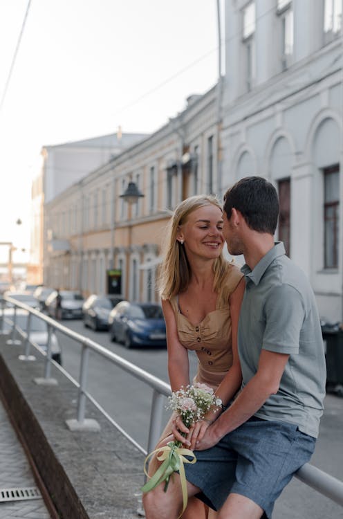 Free Couple Sitting on Handrail Stock Photo