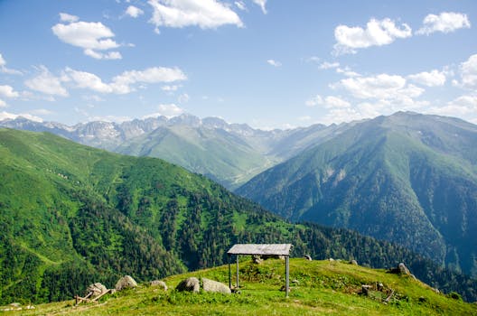 Scenic view of green mountains under a bright blue sky, perfect for nature lovers.