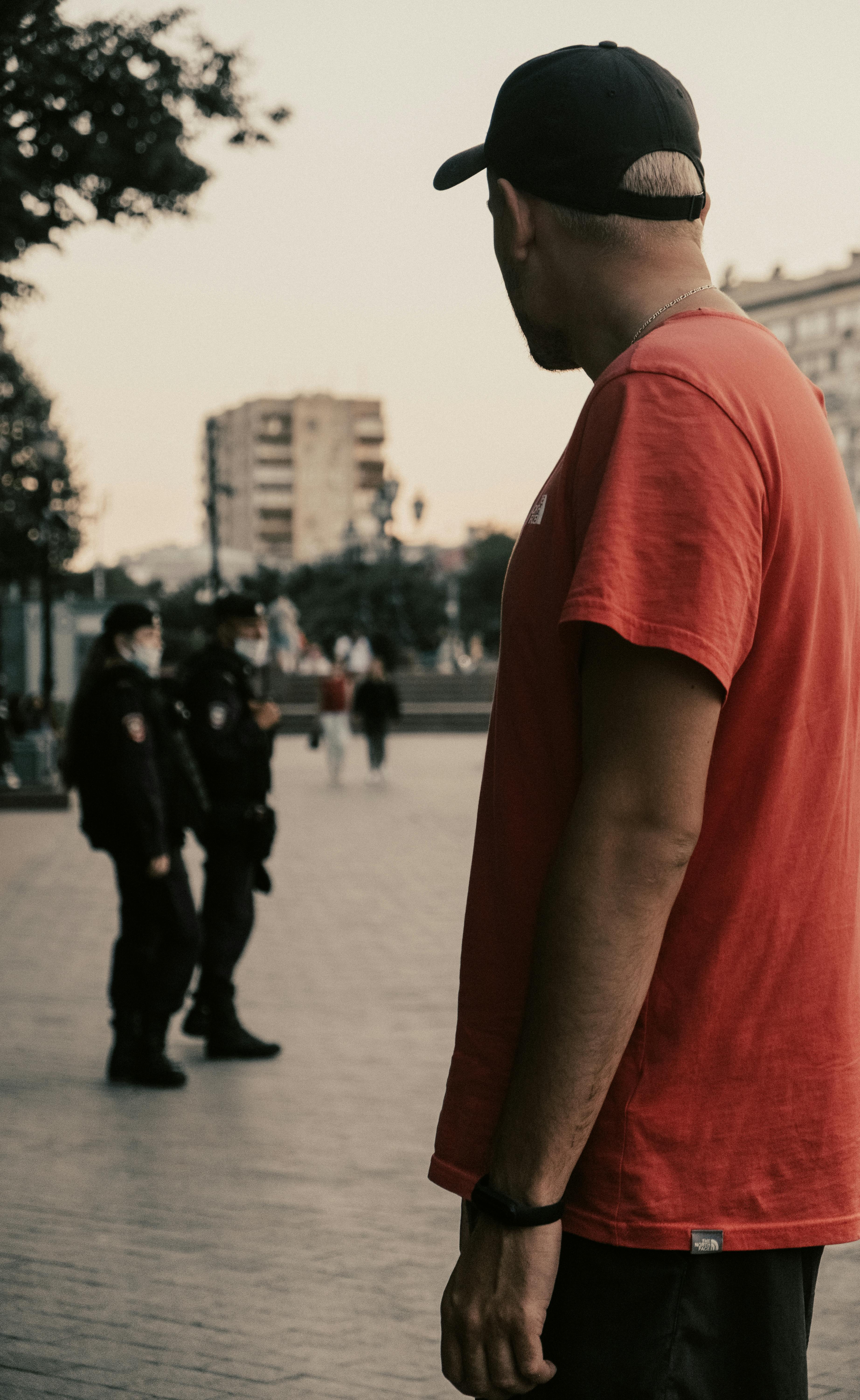 Selective focus photography of person wearing LA Dodgers cap