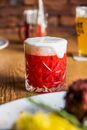 Clear Drinking Glass With Red Liquid