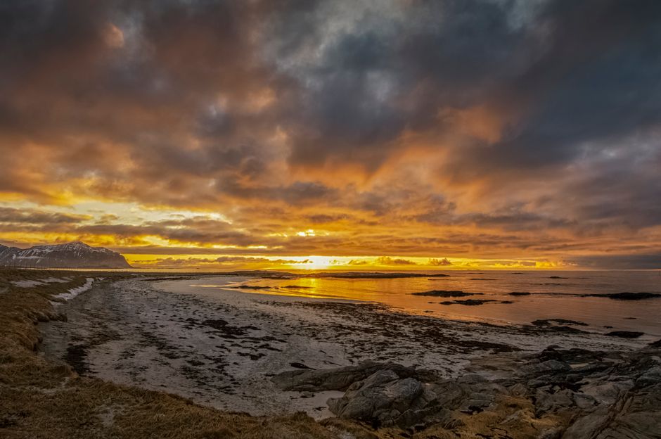 Midnight Sun over the mountains and sea in Tromsø, Norway