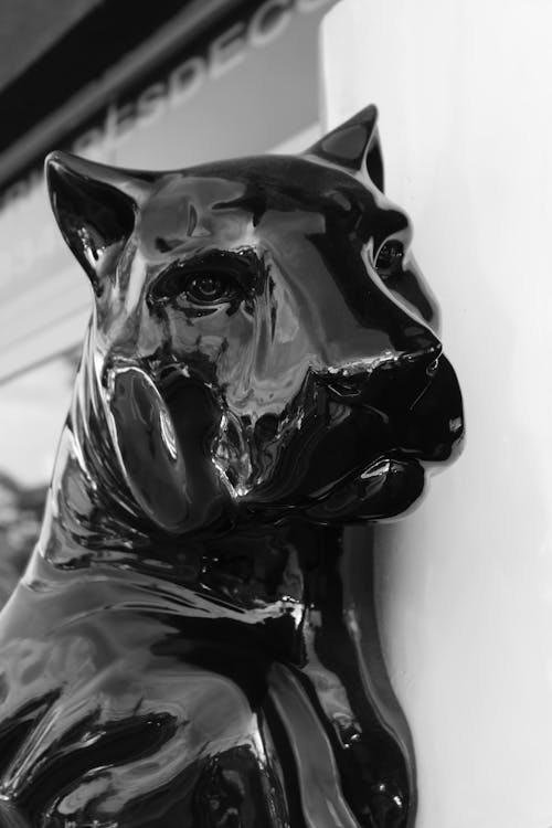 Black Dog Ceramic Figurine in Grayscale Photography