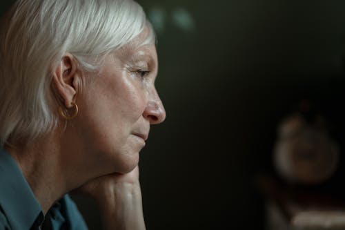 Free Side Profile of an Elderly Woman with Serious Face Stock Photo