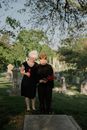 Man in Black Crew Neck Shirt Standing Beside Woman in Black Long Sleeve Dress