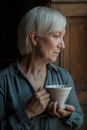 A Woman Holding White Ceramic Cup