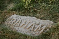 White Concrete Stone on Green Grass