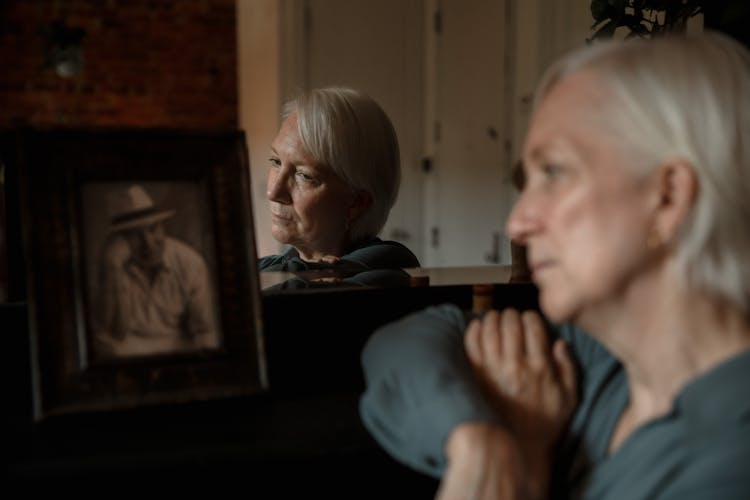 Woman Looking At A Photo